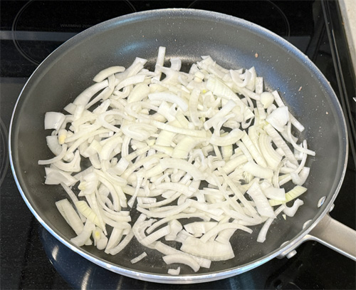 Use the same skillet and saute the bell peppers and onion. Cook for about 3-4 minutes until they soften, then add the minced garlic and cook for another 30 seconds. Pour all the ingredients into the slow cooker on top of the steak. 