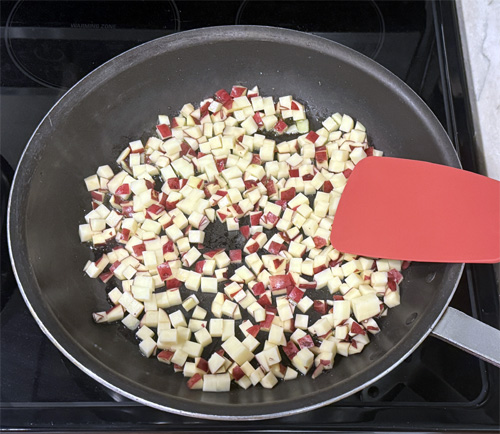 Add 2 tablespoons of olive oil and potatoes to the pan.