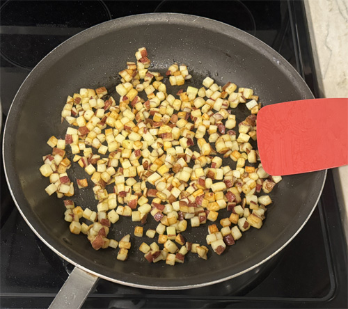 Once the potatoes are browned, remove from heat and set aside.