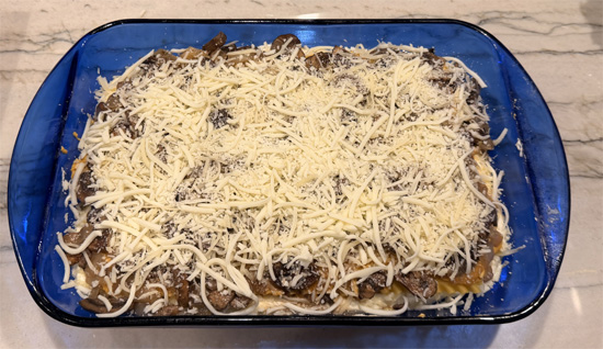 Top with remaining 3 noodles, spread with remaining pumpkin sauce, add remaining mushroom mixture, and finish with remaining cheese.