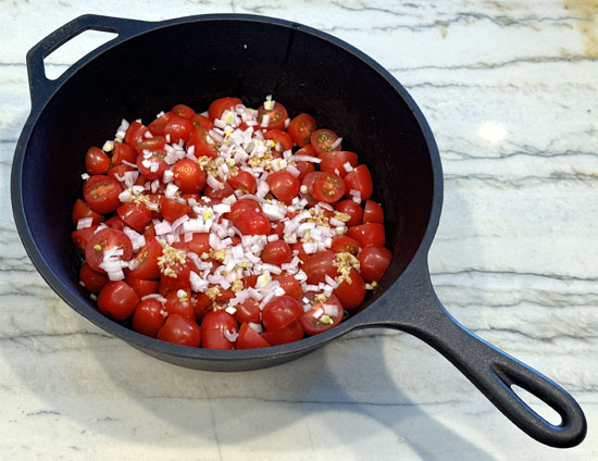 In an oven-safe baking dish, combine tomatoes, shallots, garlic, salt, feta cheese, olive oil, and Italian seasoning. Mix well.