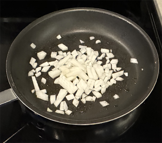 Heat a large pan over medium heat. Once it's hot add the olive oil, then saute the onions for about 5 minutes.