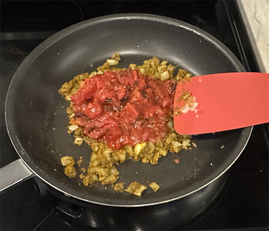 Pour in the tomatoes, coconut milk, vegetable broth (or water) and lentils.