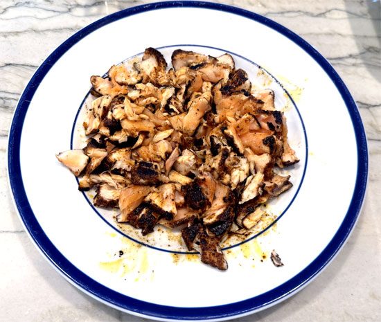 Flake the salmon with two forks into bite-sized pieces.