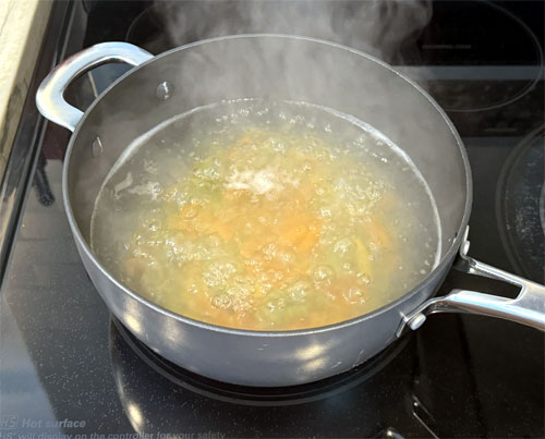 Put 8 cups of water in a pot, heat on high and bring to a rolling boil.