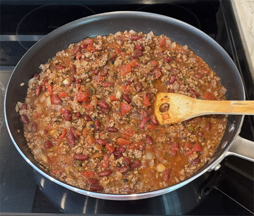 Stir in the kidney beans, olives and tomatoes.