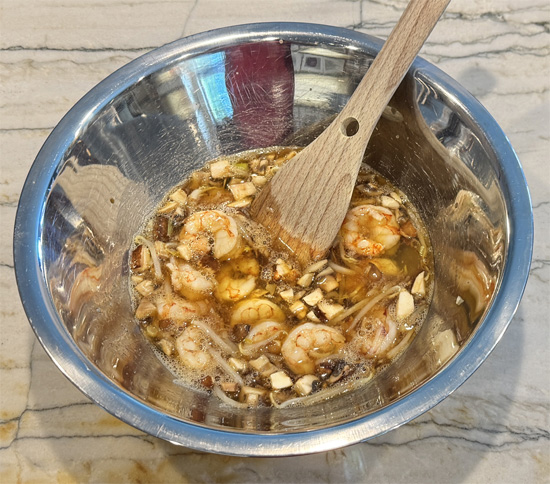 Whisk together the egg whites and soy sauce in a large bowl. Then, stir in the cooked shrimp mixture.