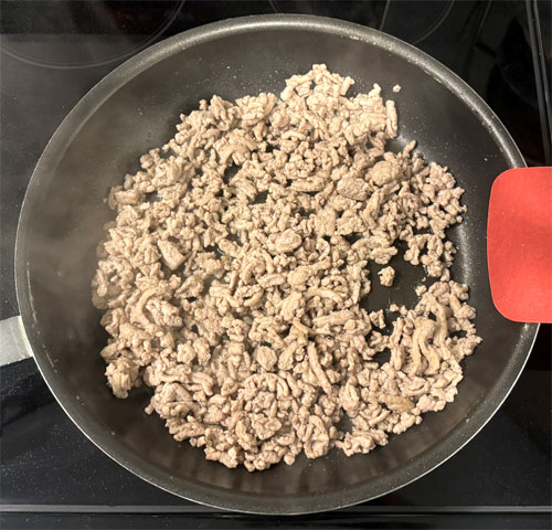Add the ground turkey and cook until it's mostly browned, about 5 minutes, stirring frequently.