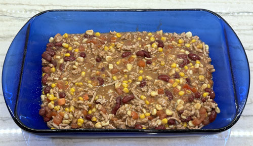 Transfer HALF the mixture into a 9x13-inch baking dish.