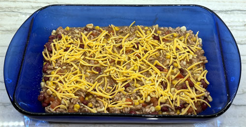 Sprinkle HALF the shredded cheddar cheese on top.