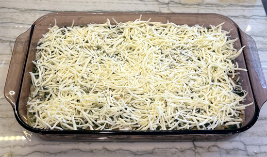 Cover the casserole with the regular mozzarella cheese, then bake in the preheated oven for 15 to 20 minutes until the cheese on top starts to brown lightly. 