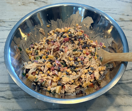 Pour the dressing over the chicken mixture and stir until evenly coated.