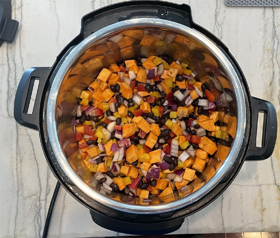 Instant pot with vegetables in it. 