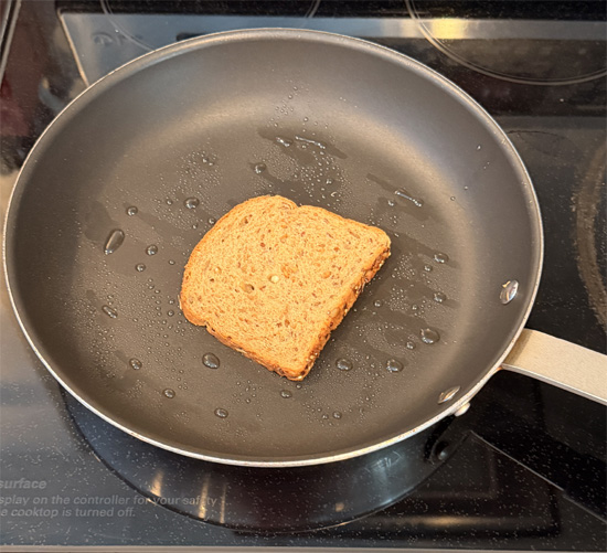 Build the sandwich: Place one slice of bread mayo-side down in the pan. Top with the cheese, then the birria meat, and finally the second slice of bread mayo-side up.