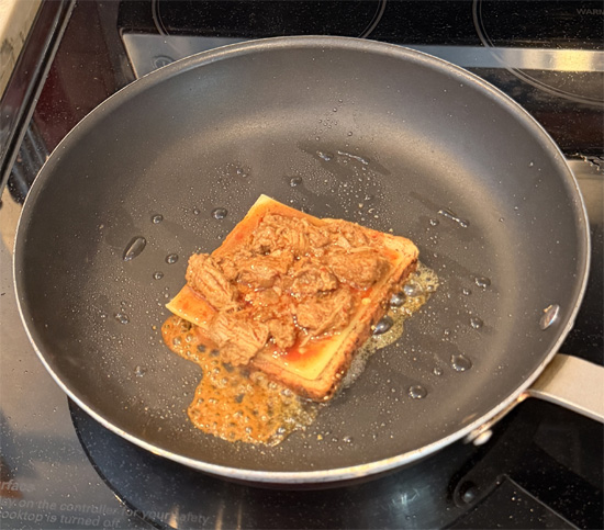 Build the sandwich: Place one slice of bread mayo-side down in the pan. Top with the cheese, then the birria meat, and finally the second slice of bread mayo-side up.