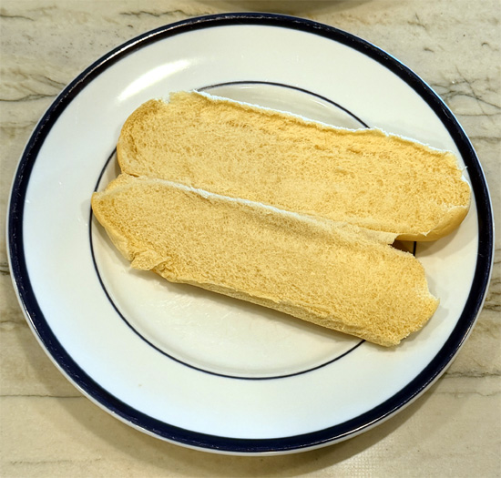 Divide salad mix between the two open faced hoagie rolls, sprinkle pepper over the top to taste and enjoy.