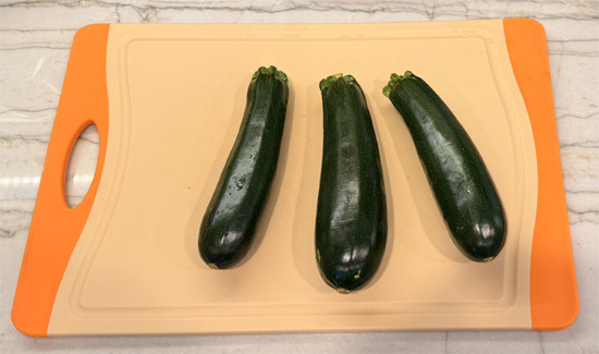Trim zucchini ends. Cut medium zucchini into quarters lengthwise; cut large zucchini into sixths (halve, then cut each half into 3 wedges).