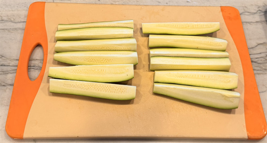 Trim zucchini ends. Cut medium zucchini into quarters lengthwise; cut large zucchini into sixths (halve, then cut each half into 3 wedges).