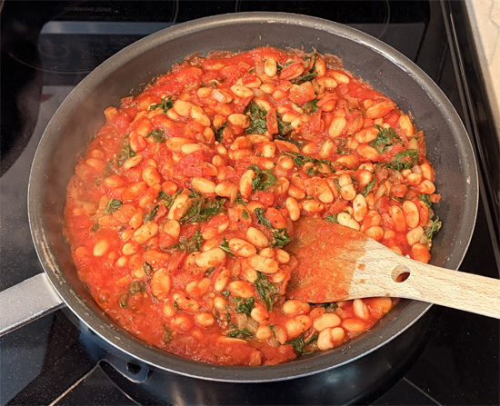 Stir in the cannellini beans and pasta sauce.