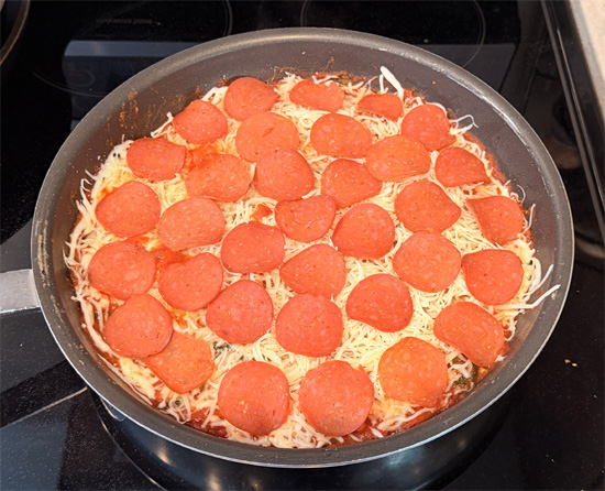 Arrange the remaining pepperoni slices over top the cheese.