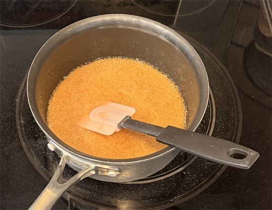 In a saucepan over medium heat, stir together the sugar free brown sugar, light corn syrup, canola oil and sugar free honey, stirring until the sugar fully dissolves, about 3-4 minutes.