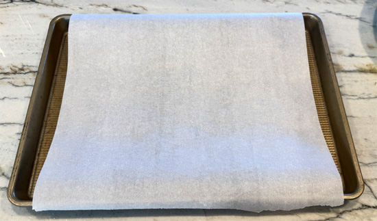 Line a baking sheet with parchment paper.