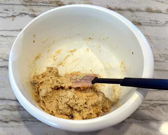 Add ice cream. Pour the entire pint of melted ice cream into the dry ingredients. Stir gently until just combined. Don't overmix.