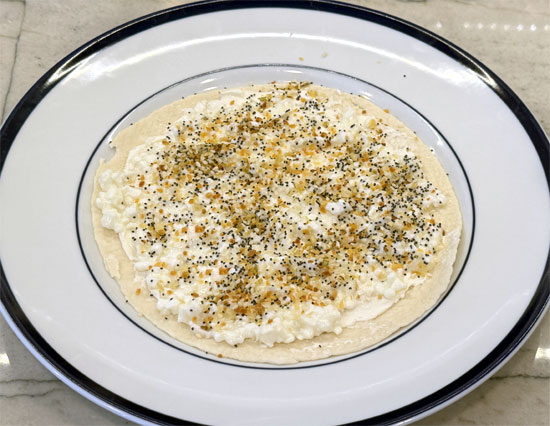 Sprinkle the Everything Bagel seasoning over the cottage cheese.