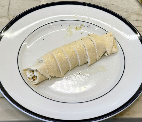Slice the rolled tortilla into 8 pieces.