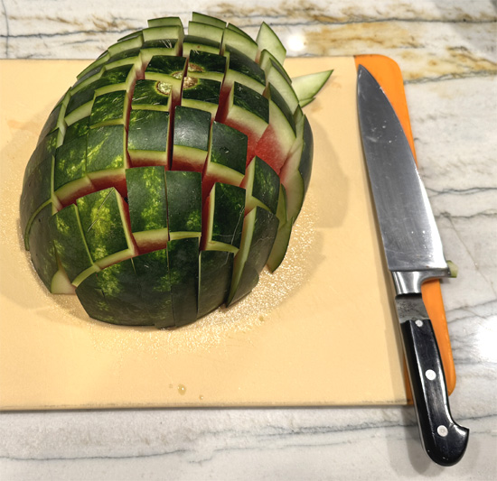 Now, rotate the watermelon 90° and slice again, making a criss-cross. You’ll end up with sturdy, easy-to-grab spears.