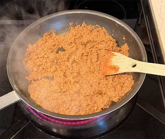 Add the ground beef to the pan, mix together and keep stirring until fully browned, about 5-7 minutes.