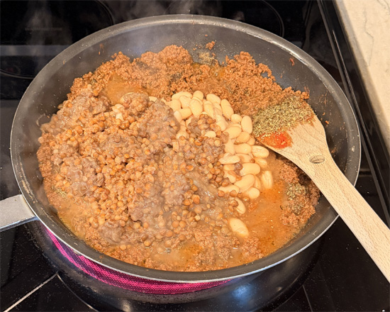 Stir in the salt, pepper, chili flakes, Italian seasoning, basil, cannellini beans, vodka sauce and lentils. Mix together.
