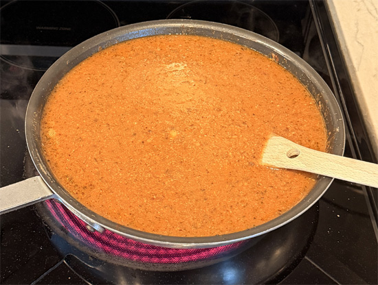 Stir in the bone broth and water. Bring everything to a light simmer.