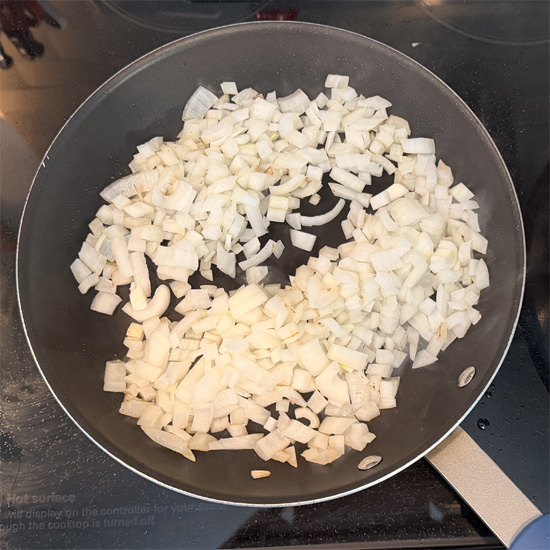 Put the onions in the pan and sauté for approximately 3 minutes, until they're browned. 