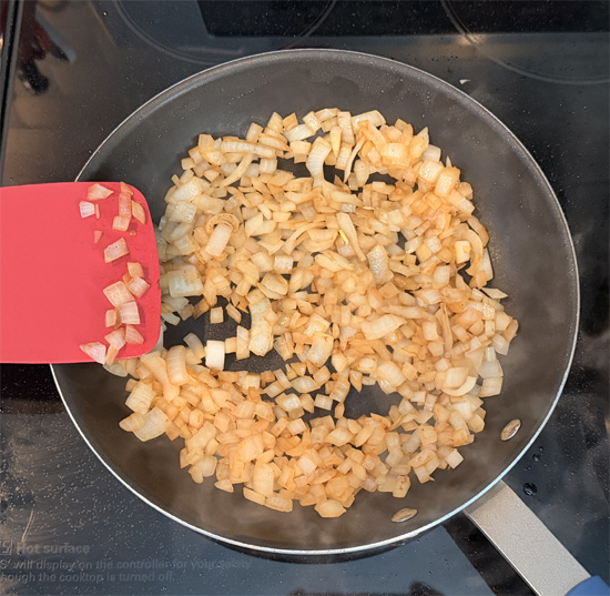 Put the onions in the pan and sauté for approximately 3 minutes, until they're browned. 