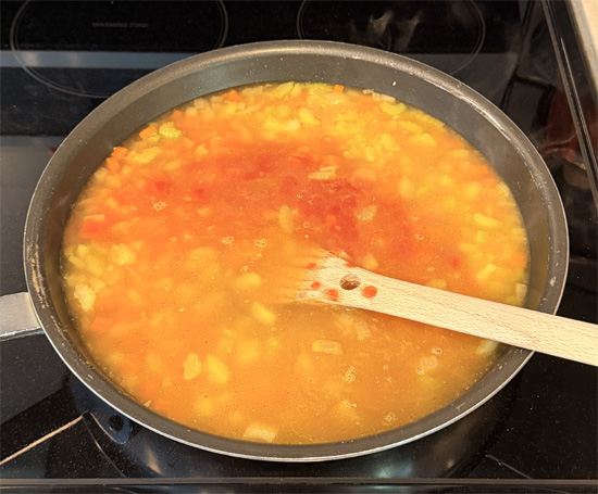 Stir in all the remaining ingredients EXCEPT macaroni. Bring to a boil, then reduce heat to low, cover and simmer for 16 minutes. 