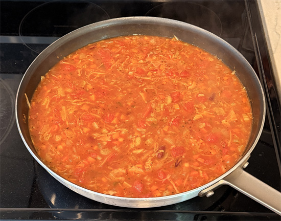 Stir in all the remaining ingredients EXCEPT macaroni. Bring to a boil, then reduce heat to low, cover and simmer for 16 minutes. 