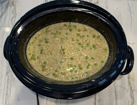 After cooking for 3 hours, stir the frozen peas into the mixture and cook on high for 1 hour more.