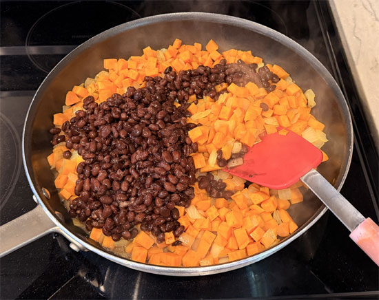 Stir in black beans and tomatoes.