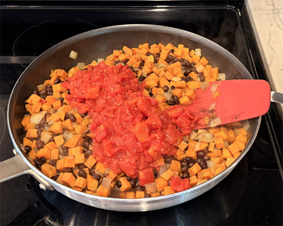 Stir in black beans and tomatoes.