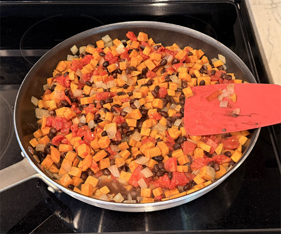 Stir in black beans and tomatoes.