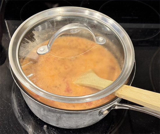 Bring to a boil over medium-high heat. Partly cover the pot with a lid, reduce the heat to medium-low, and cook for about 15 minutes, stirring occasionally.