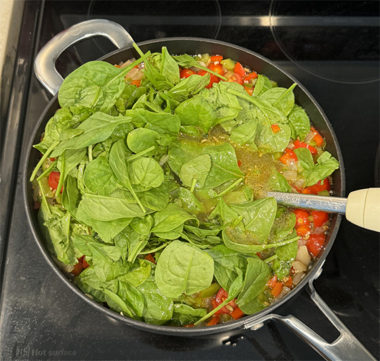Add the spinach and cook until wilted. Adjust the seasoning to your preference.