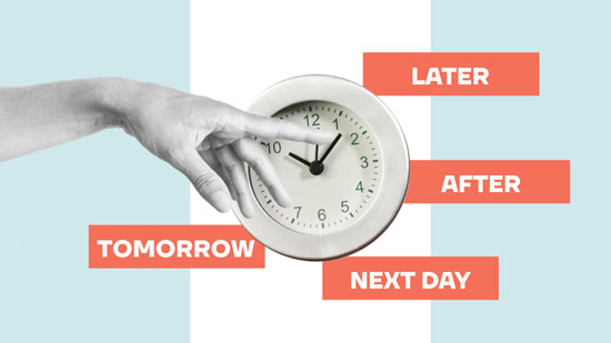 Fingers on the minute hand of a clock.