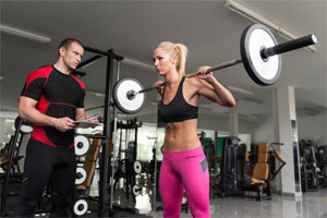 Squats with a trainer. 